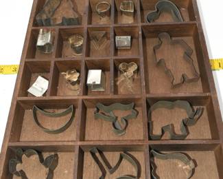 lot of vintage cookie cutters with display case
