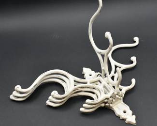 weathered white metal wall hook
