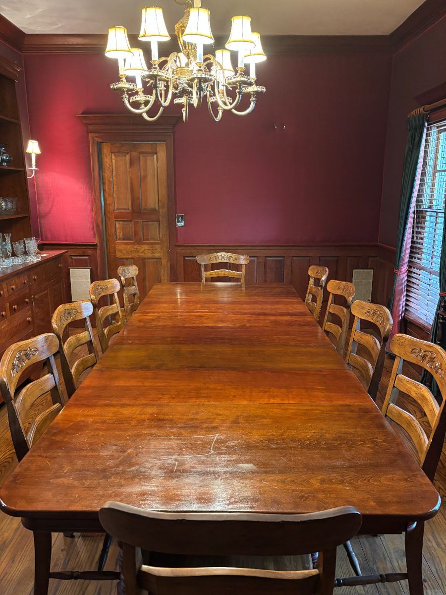 Beautiful Cherry Dining Room Table with 5 leaves. Without leaves, it makes a cozy square table. 12 Walnut chairs.
