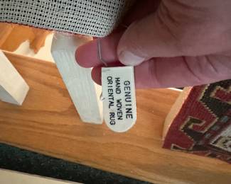 D169 - $250. LARGE hand woven area rug. The other side has significant fading. Needs Cleaned.