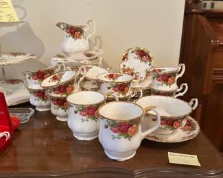 D80 - $150. Old Country Roses Royal Albert Bone China. 8 Tea Cups & Saucers, 2 Coffee Cups, 2 Demitasse Cups & Saucers, Soup Bowl & Saucer, 7 salad plates, 8 dessert plates, Creamer, 3 tiered tray.