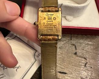 S13 - $600. Cartier Ladies Watch with Box & Paperwork. Currently not running - we have not tried to replace the battery.