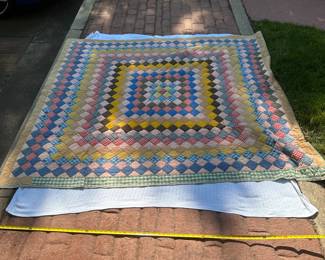 D61 - $95. Hand Pieced Quilt in Beautiful Condition. See Tape Measure on ground for an idea of size.