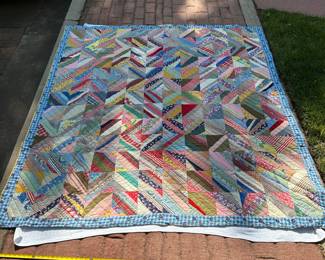 D60 - $125. Hand Pieced Quilt in Beautiful Condition. See Tape Measure on ground for an idea of size.