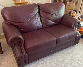 D12 - $100. Faux Leather Loveseat. Measures 62" wide x 28" deep x 33" tall. Floor to seat is 17".