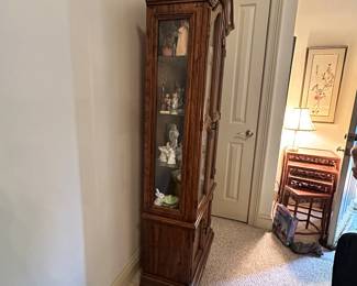 D31 - $75. Lighted Curio Cabinet measures 26" wide x 12.5" deep x 73.5" tall.