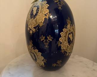 D100 - $10. Large Porcelain Egg - does have a large crack. Measures 12" tall.