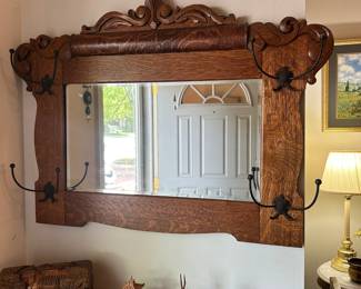 D24 - $175. Antique Oak Framed Mirror with Hooks. Measures 37" wide x 31.5" tall. Excellent Condition!