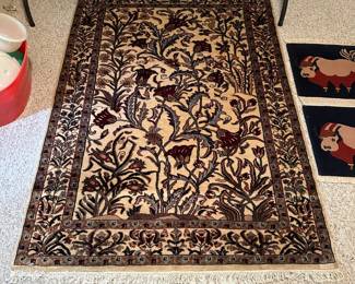 D132 - $100. Wool Area Rug. Measures 49" x 69".