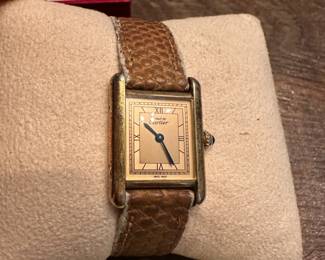 S13 - $600. Cartier Ladies Watch with Box & Paperwork. Currently not running - we have not tried to replace the battery.