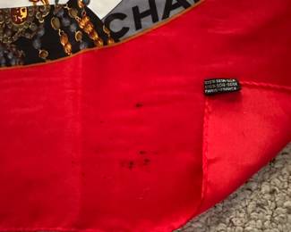 D9 - $150. Chanel Paris Scarf. 100% Seta-Silk. Signature Chanel CC Interlocking Logo Scarf. Does have some staining.