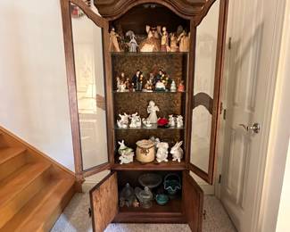 D31 - $75. Lighted Curio Cabinet measures 26" wide x 12.5" deep x 73.5" tall.