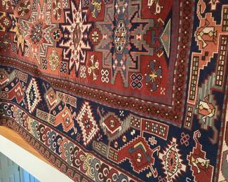 D169 - $250. LARGE hand woven area rug. The other side has significant fading. Needs Cleaned.