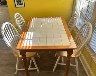 D16 - $100. Tile Top Table with 4 Chairs. Measures 48" x 31" x 29" tall.