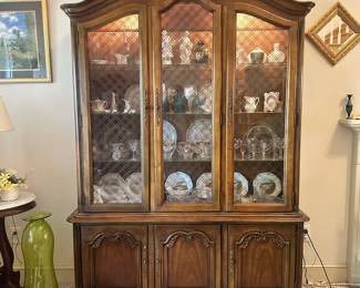 D46 - $150. Lighted China Display Cabinet. Assembled it is 80.5" tall. Base Measures 57" wide x 16" deep x 25" tall. Top Measures 54" wide x 14" deep x 55.5" tall.