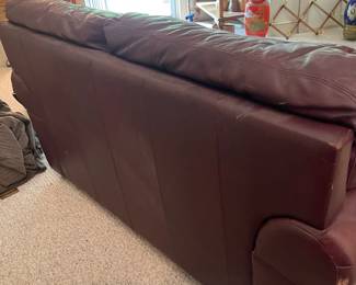 D12 - $100. Faux Leather Loveseat. Measures 62" wide x 28" deep x 33" tall. Floor to seat is 17".
