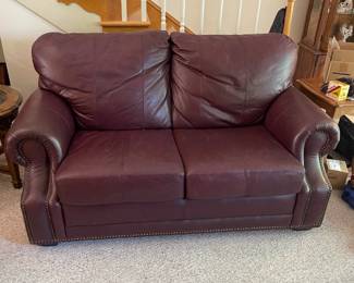 D12 - $100. Faux Leather Loveseat. Measures 62" wide x 28" deep x 33" tall. Floor to seat is 17".
