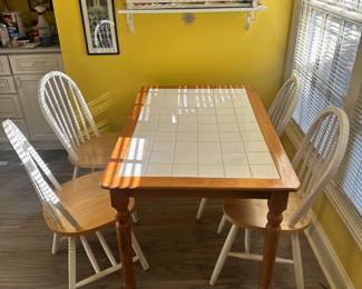 D16 - $100. Tile Top Table with 4 Chairs. Measures 48" x 31" x 29" tall.