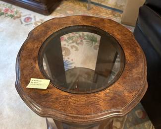 D79 - $30. Small Side Table with Single Shelf. Measures 16" round x 22" tall.