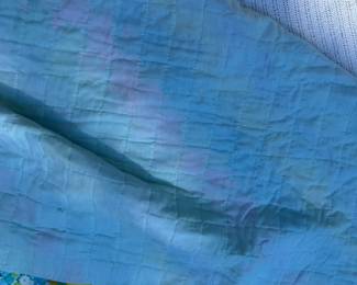 D64 - $100. Beautiful Homemade Quilt. Excellent Condition! See Tape Measure on ground for an idea of size.