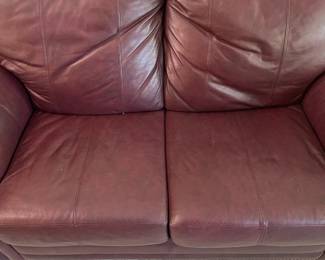D12 - $100. Faux Leather Loveseat. Measures 62" wide x 28" deep x 33" tall. Floor to seat is 17".