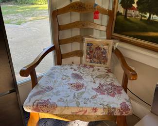 Newly recovered chair with painted flowers on back