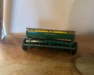 Vintage metal John Deere seeder
