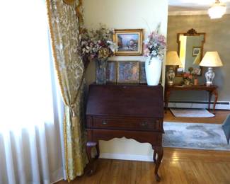 Drop front desk, silk flowers, framed pictures