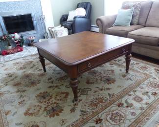 Pair of neutral sofas, side table, coffee table with storage drawer, area rug