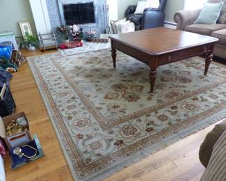 Pair of neutral sofas, side table, coffee table with storage drawer, area rug
