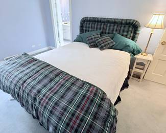 Queen size custom upholstered bed frame with bedding