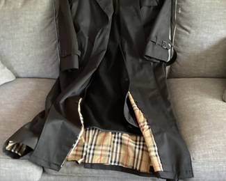 Ladies black Burberry trench coat.