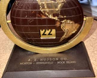 Metal globe desk calendar made by A.E. Hudson Co.