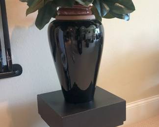 Large floral vase on black pedestal