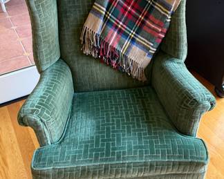 Green velvet wingback armchair