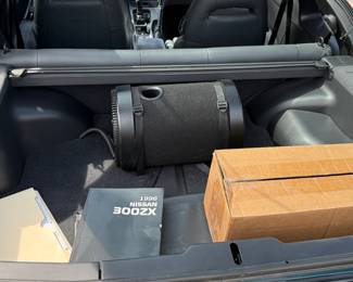 Trunk with roll-up privacy screen