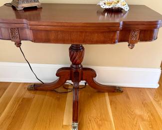 Vintage scalloped edge accent table with brass claw feet
