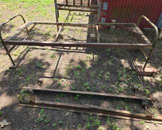 Vintage military cot. Legs fold in. 'U S' stamped on both ends.