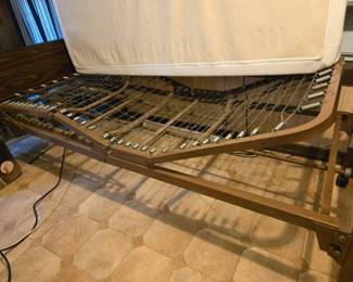 Showing 'Invacare' bed springs condition and adjusted bed head and foot section. Works good.
