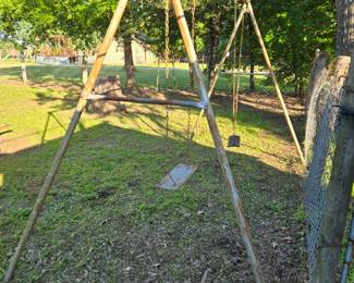 Vintage swing set. It is rusty so will need some work to make it safe for kids but you may have other ideas for its use.