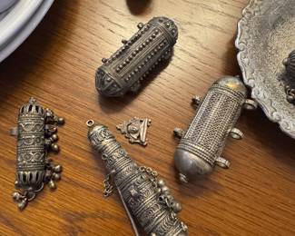 antique prayer pendants, and Kohl eyeliner, pot bottle tower with applicator.