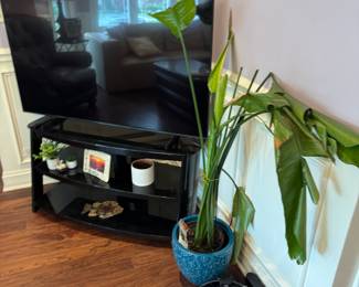  Black lacquered, and glass television stand