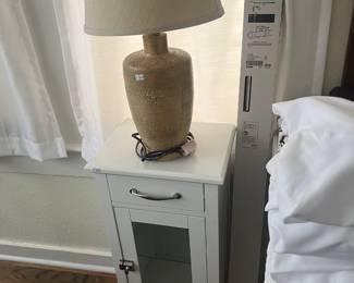 sheets, sidetable, lamp, curtain rod