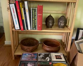 Foreign language, cassettes, Buddha heads, and CDs