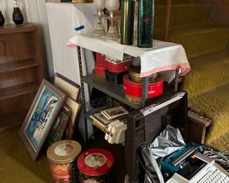Tin cans, lamps, art, typewriter.
