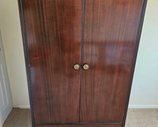 Perfect armoire for storage, I put gliders in so the doors slide inside