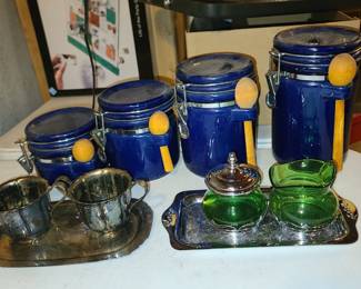 Vintage canisters with scoops and silver plate serving pieces