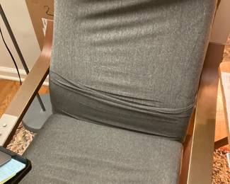 Grey Upholstered chair with wood arms