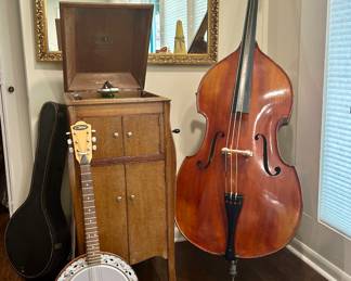 Exquisite 1930's German made Bass Violin. This instrument is a high-end piece, beautifully carved. The Francini ( Italy) piano accordian, victrola, and beautiful banjo are also lovely!