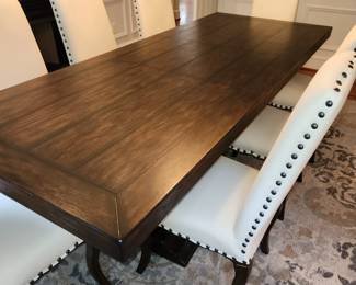 Dining table (Lorraine model) w/ 1 leaf and 10 chairs by Pottery Barn.